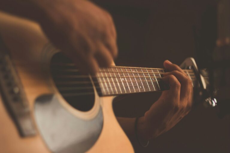Acoustic guitar on a wooden floor